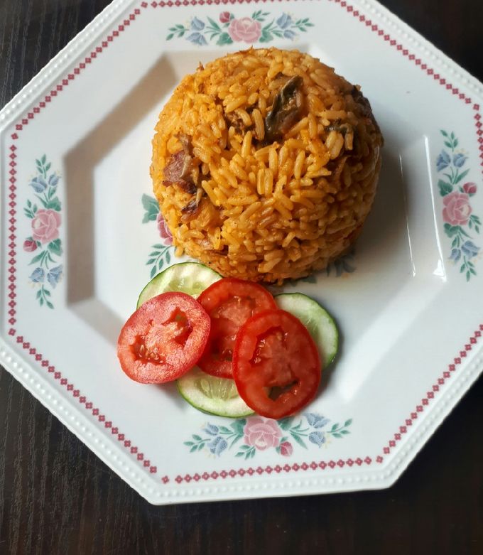 A picture of Jollof rice with dried fish.