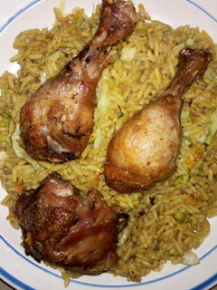 A picture of Fried Rice and chicken.