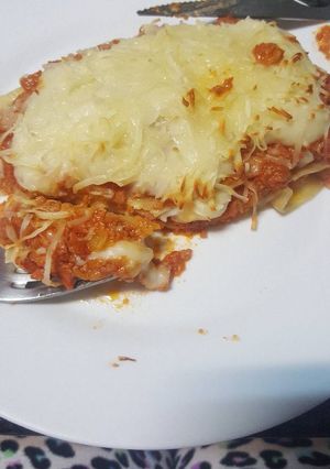 Una foto de Porción de lasaña