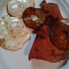 A picture of Leftover pineapple and ham with eggs.
