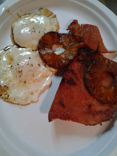 A picture of Leftover pineapple and ham with eggs.