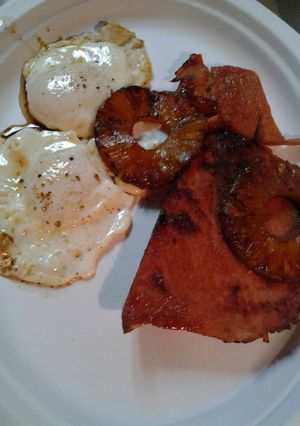A picture of Leftover pineapple and ham with eggs.
