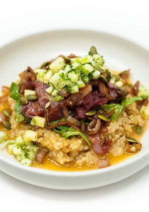 A picture of Tuna Poke Bowl with Caramelized Shallots and Rosé Vinaigrette.