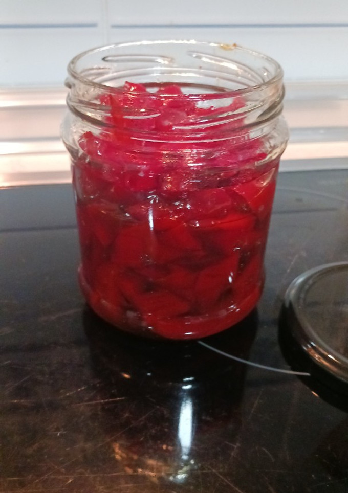Una foto de Pimientos rojos confitados