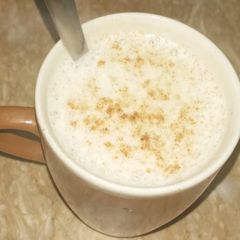 A picture of Milky frothy coffee.