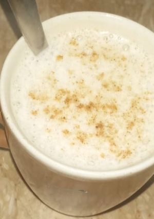 A picture of Milky frothy coffee.