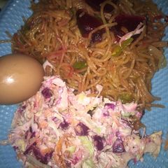 A picture of Fried spaghetti with betruis coleslaw.