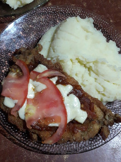 Una foto de Milanesa de pollo a la napolitana