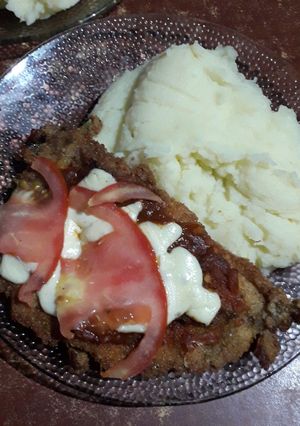 Una foto de Milanesa de pollo a la napolitana