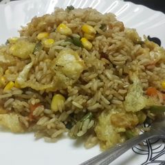 A picture of Sweet corn veg and egg drop fried rice.
