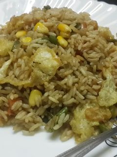 A picture of Sweet corn veg and egg drop fried rice.