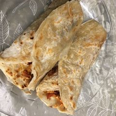 A picture of Paratha kebabs  wrap with egg.