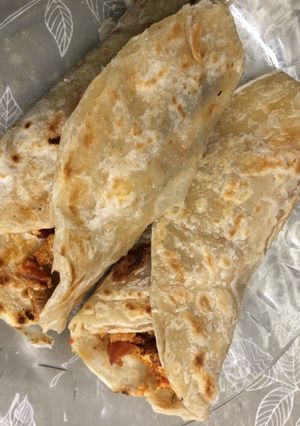 A picture of Paratha kebabs wrap with egg.