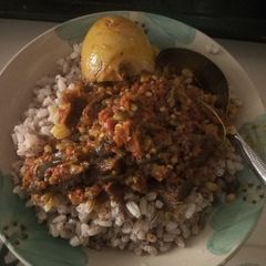 A picture of Ofada rice and stew.