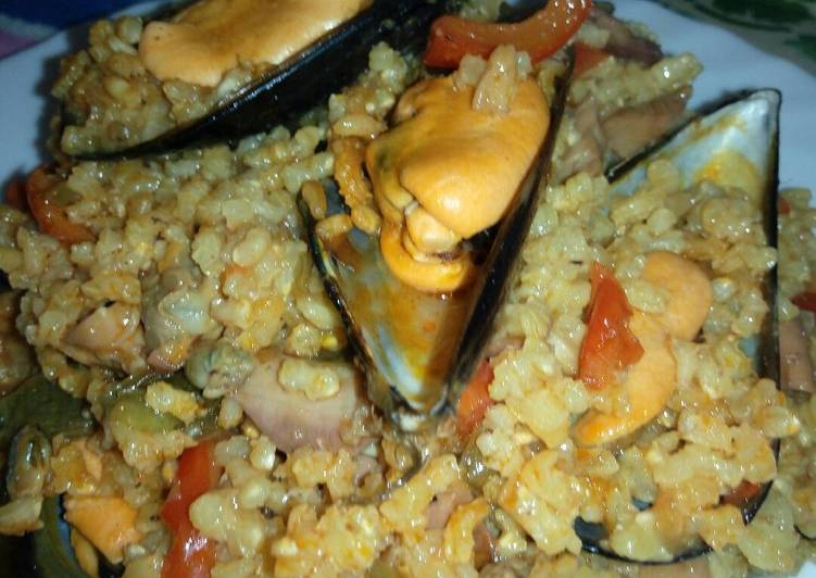 Arroz con berberechos, pulpo y mejillones de conservas