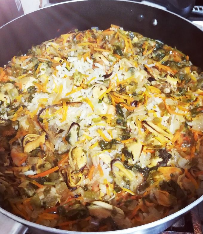 Una foto de Un rico arroz con surtido de mariscos