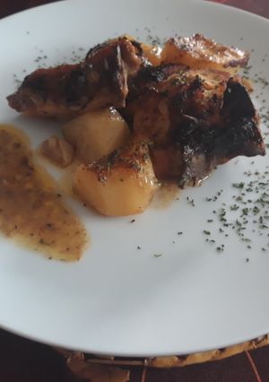 Una foto de Pollo asado con papas bbq