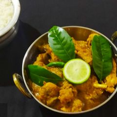 A picture of Gandhoraj Chicken/Murgi(Kaffir Lime flavoured Chicken Curry).