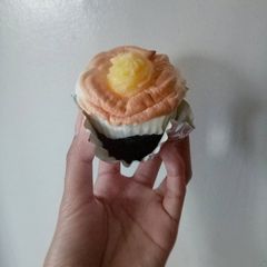 A picture of Moist Chocolate Cupcake Topped with Brazo de Mercedes.