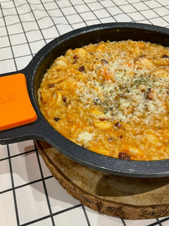 Una foto de Arroz meloso de pulpo “a feira”, langostinos y queso