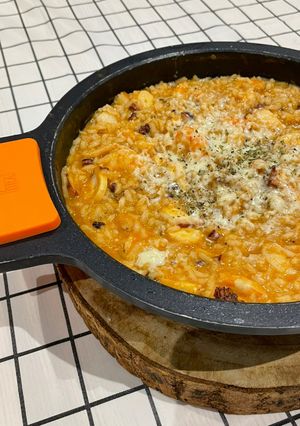 Una foto de Arroz meloso de pulpo “a feira”, langostinos y queso