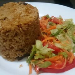 A picture of Pilau and salad.