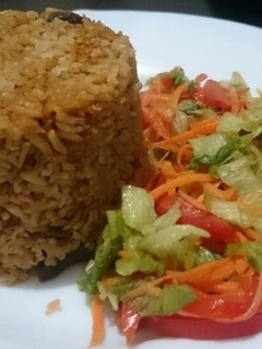 A picture of Pilau and salad.