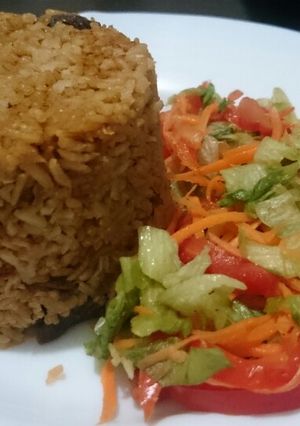 A picture of Pilau and salad.
