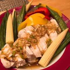 A picture of Steamed chicken & vegetables with Asian style sauce.