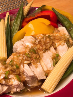 A picture of Steamed chicken & vegetables with Asian style sauce.