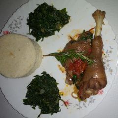 A picture of Cornbread with chicken stew and sautèed spinach.