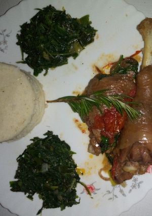 A picture of Cornbread with chicken stew and sautèed spinach.