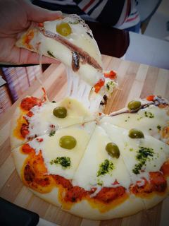 Una foto de 🍕🍅Pizza 🍅🍕
