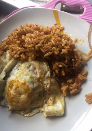 A picture of Quickie Jollof Rice and Sunny Side Up.