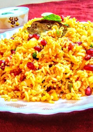 A picture of Tomato and corn biryani.