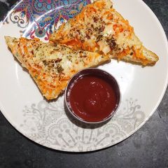 A picture of Carrot toast with cheese spread.