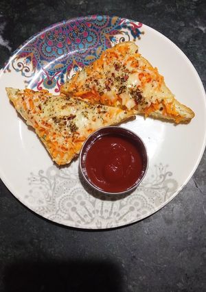A picture of Carrot toast with cheese spread.