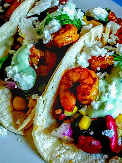 A picture of Blackened Cajun Shrimp Tacos with Cilantro Lime dressing.