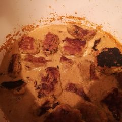 A picture of Raw banana balls in creamy gravy.
