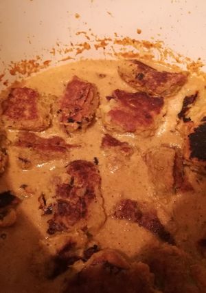 A picture of Raw banana balls in creamy gravy.