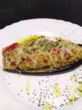 Berenjena rellena de quinoa atún y pimientos