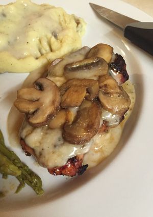 A picture of Grilled Pork Chops With Creamy Mushroom Sauce.