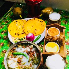 A picture of Sarson Ka Saag Makki Ki Roti,ghee-shakker & gur.
