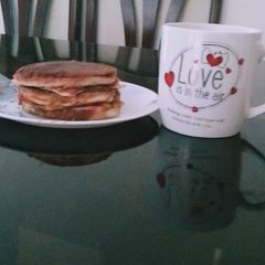 A picture of Bread burger with coffee.