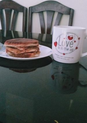 A picture of Bread burger with coffee.