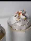 Vanilla mug cake with whipped cream and sprinkles