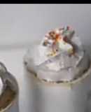 Vanilla mug cake with whipped cream and sprinkles