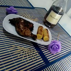 A picture of Grilled chicken and plantain.