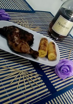 A picture of Grilled chicken and plantain.