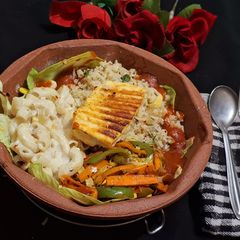 A picture of Veg Sizzler with Paneer Steak and creamy Pasta.